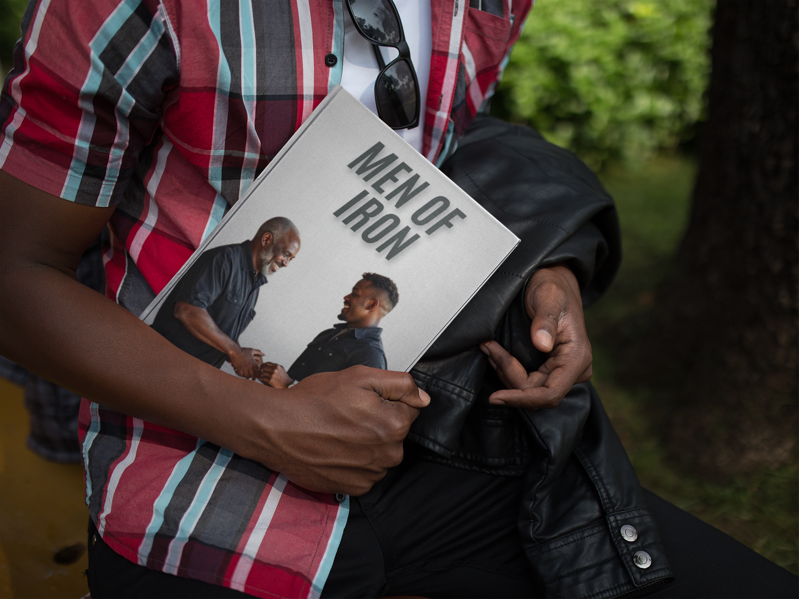 hardcover-book-mockup-held-by-a-young-black-man-a12034 hardcover-book-mockup-held-by-a-young-black-man-a12034